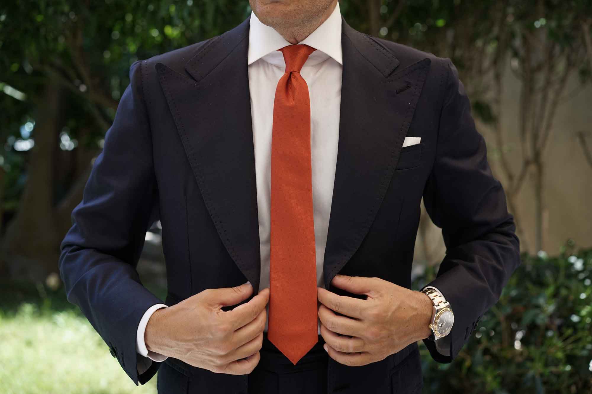 black suit orange tie